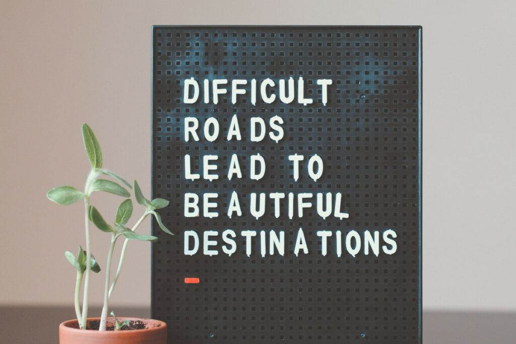 Sign stating that difficult roads lead to beautiful outcomes